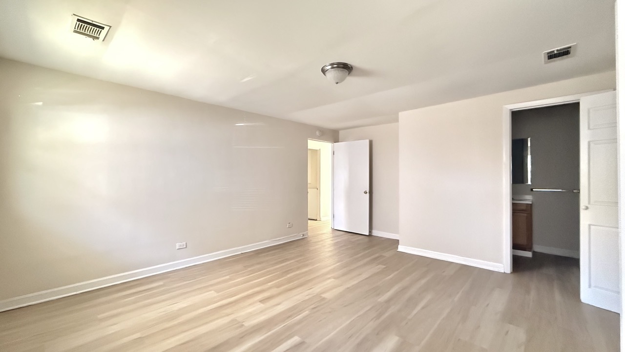 1828 183rd Street Homewood, IL 60430 - Photo 16 of 21 a view of an empty room with wooden floor