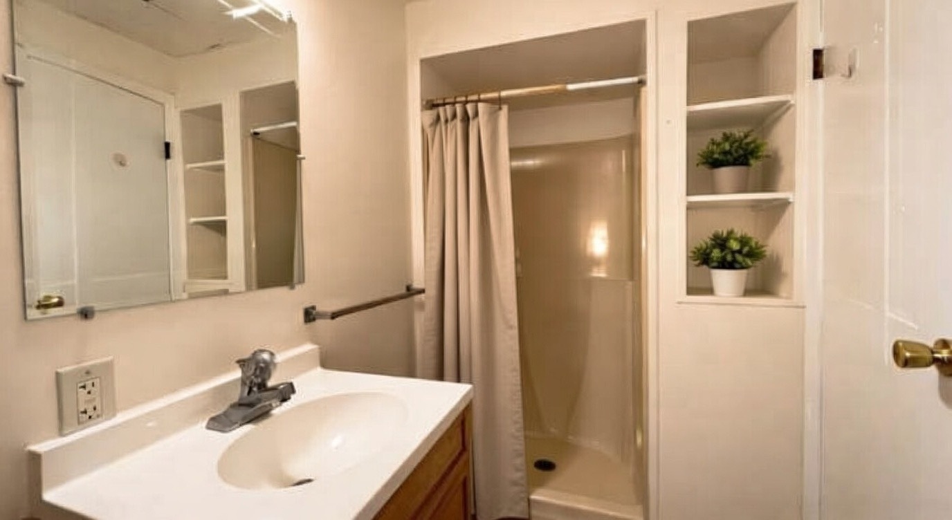 1828 183rd Street Homewood, IL 60430 - Photo 18 of 21 a bathroom with a sink and a mirror