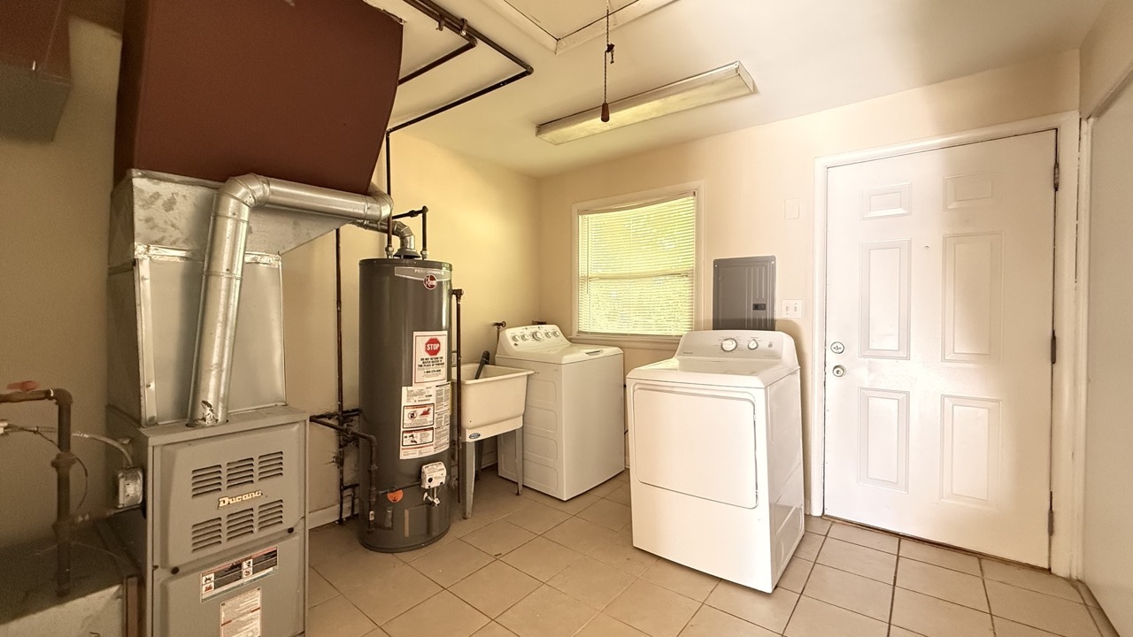 1828 183rd Street Homewood, IL 60430 - Photo 19 of 21 a view of a storage and utility room with washer and dryer