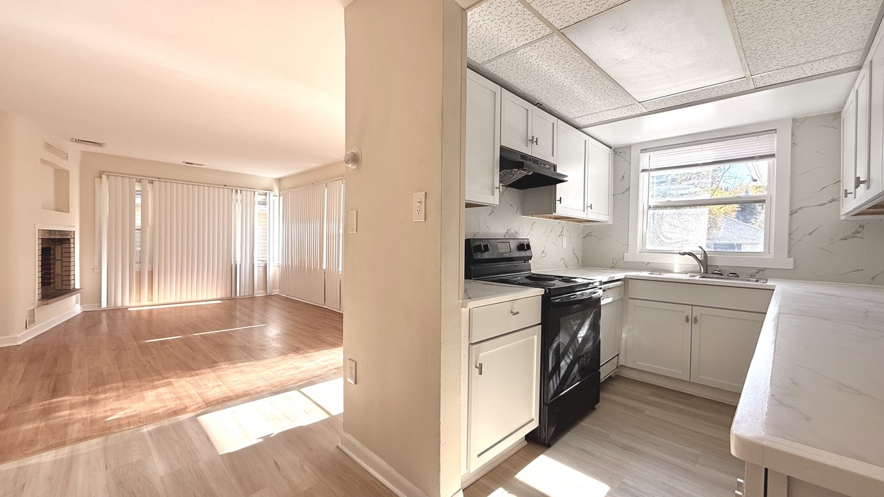 1828 183rd Street Homewood, IL 60430 - Photo 8 of 21 a kitchen with stainless steel appliances granite countertop a stove a sink and a refrigerator