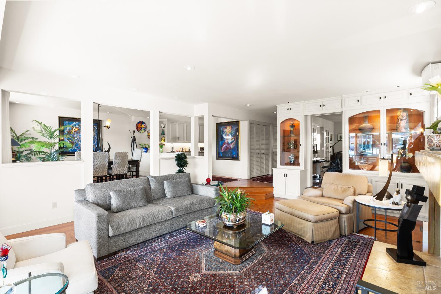 26 Mooring Road San Rafael, CA 94901 - Photo 14 of 60 The inviting living room flows directly out to the entertaining deck and boat dock and features teak parquet floors and a wood burning fireplace with gas starter.