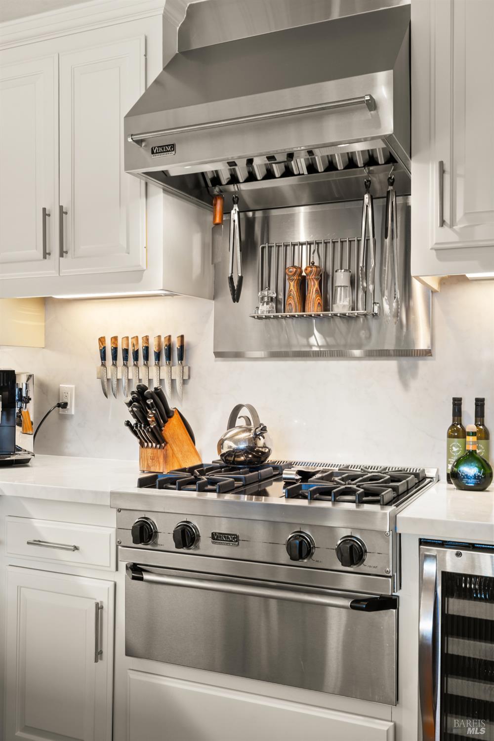 26 Mooring Road San Rafael, CA 94901 - Photo 21 of 60 The kitchen features high-end stainless appliances and is open to the dining/living area. Recent upgrades include new quartz counters and backsplash, newly painted cabinets and new hardware.