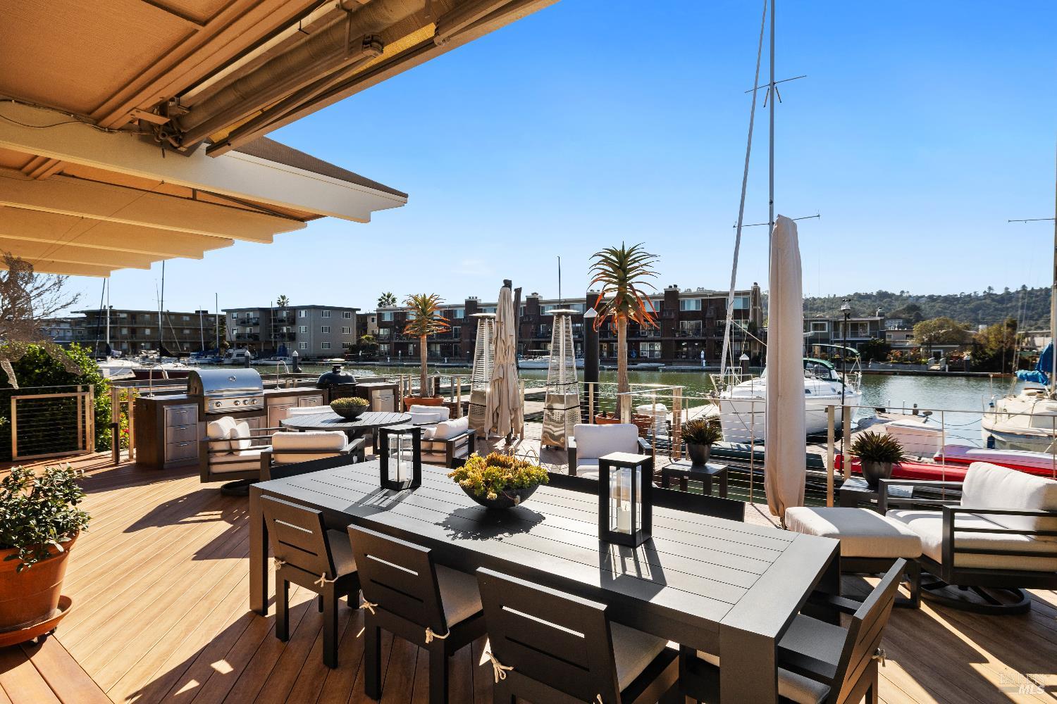 26 Mooring Road San Rafael, CA 94901 - Photo 23 of 60 The stunning entertaining deck is just off the living room and includes an outdoor kitchen and built in awnings and umbrellas. A ramp leads out to the 2-slip boat dock.