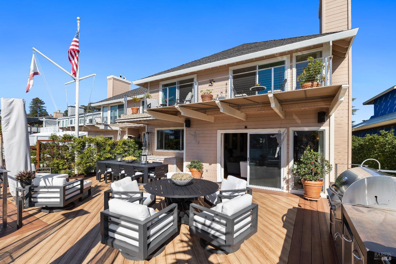 26 Mooring Road San Rafael, CA 94901 - Photo 24 of 60 The stunning entertaining deck is just off the living room and includes an outdoor kitchen and built in awnings and umbrellas. A ramp leads out to the 2-slip boat dock.