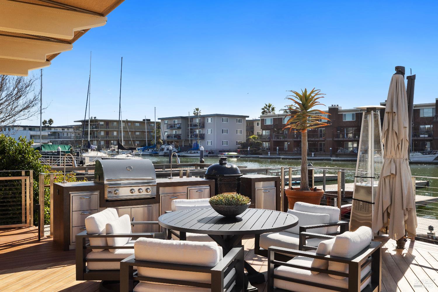 26 Mooring Road San Rafael, CA 94901 - Photo 26 of 60 The stunning entertaining deck is just off the living room and includes an outdoor kitchen and built in awnings and umbrellas. A ramp leads out to the 2-slip boat dock.