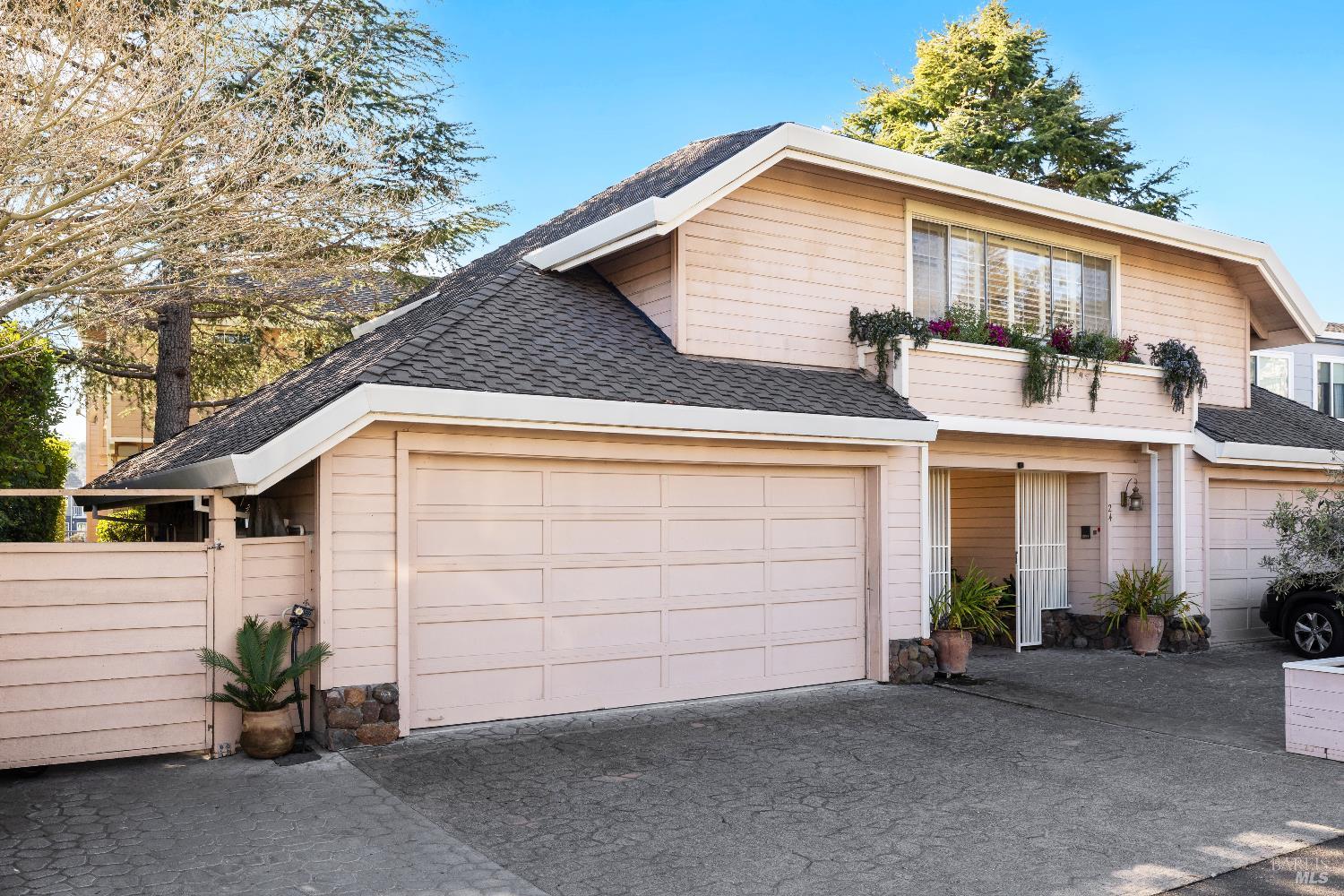 26 Mooring Road San Rafael, CA 94901 - Photo 5 of 60 The condo comes with it's own 2-car garage and 2 parking spaces in front of the garage. A shared guest house/ADU is located over the garages.