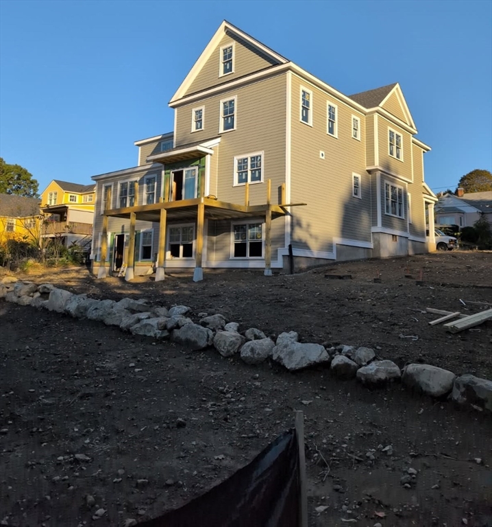 39 Town Way Winchester, MA 01890 - Photo 4 of 13 a front view of a house with a yard