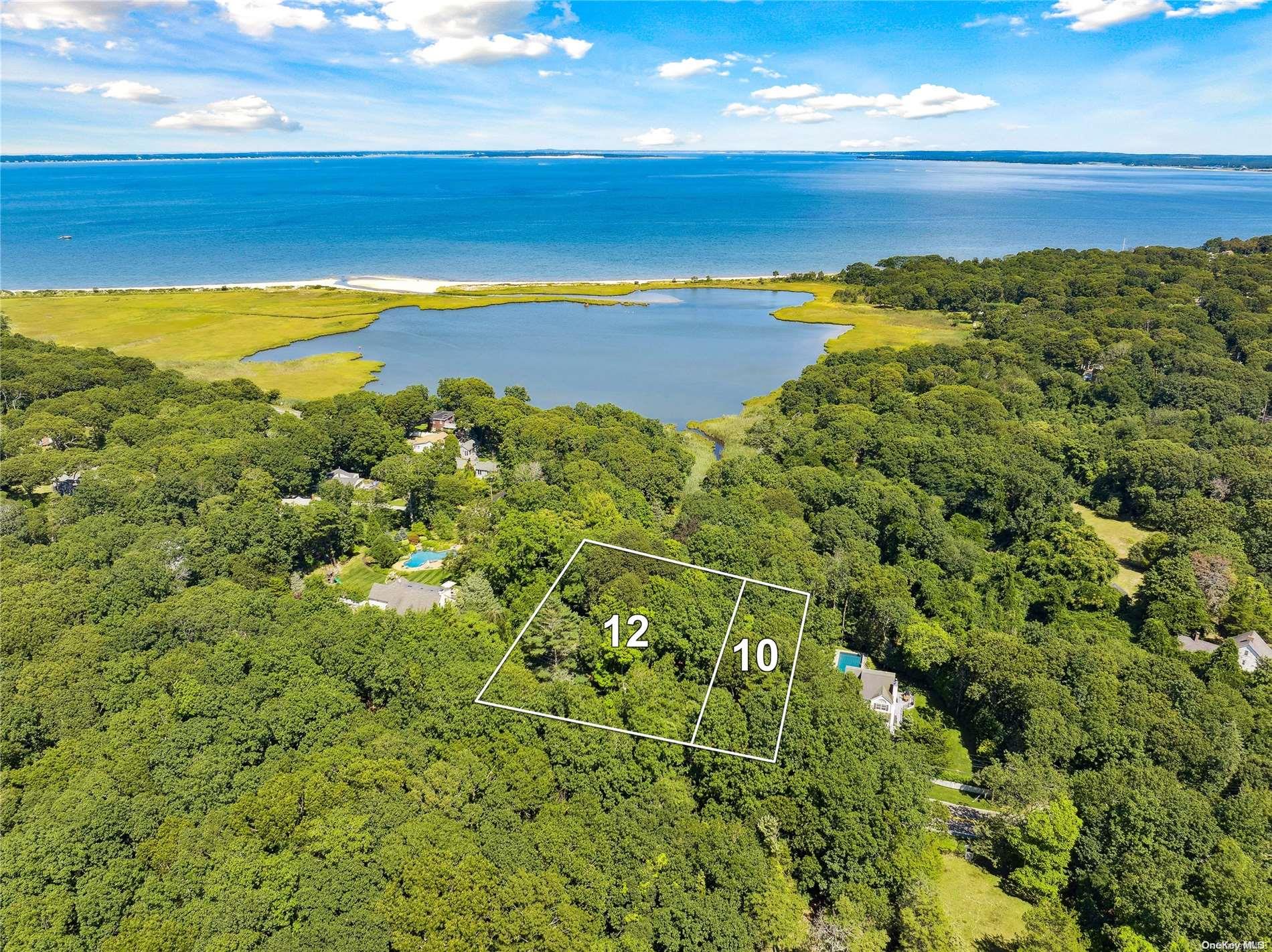12 Red Creek Road Hampton Bays, NY 11946 - Photo 1 of 1 a view of an ocean and a mountain