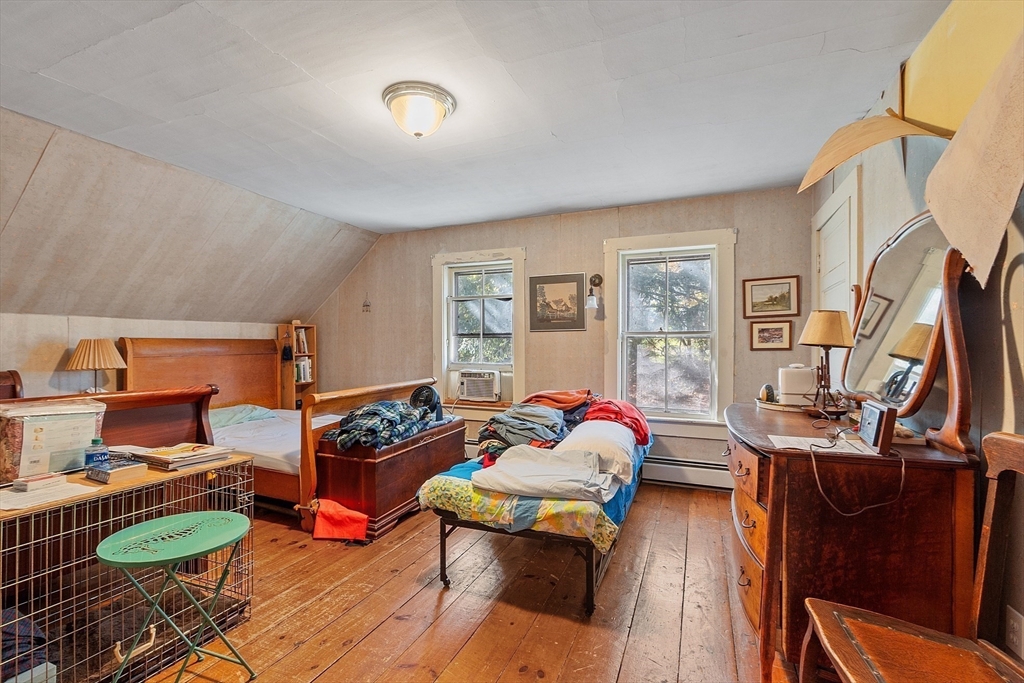51 Farwell Road Tyngsborough, MA 01879 - Photo 16 of 33 a living room with furniture and a wooden floor