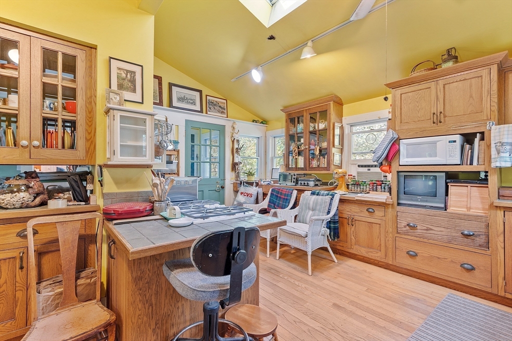 51 Farwell Road Tyngsborough, MA 01879 - Photo 2 of 33 a dining room with furniture and wooden floor