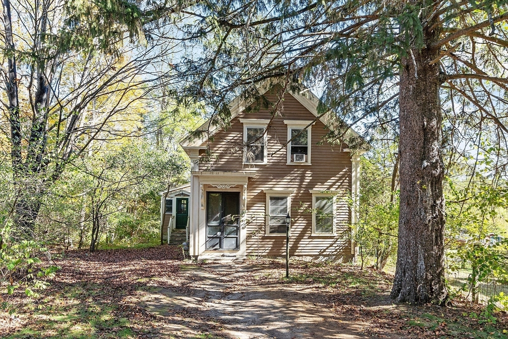 51 Farwell Road Tyngsborough, MA 01879 - Photo 21 of 33 a front view of a house with a yard