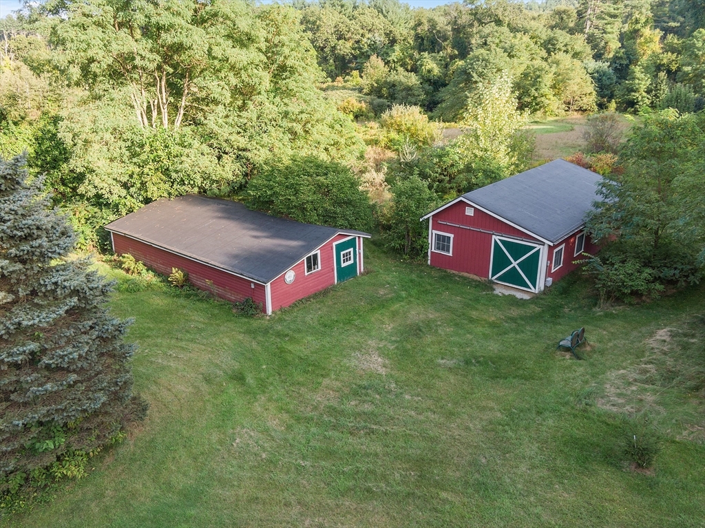 51 Farwell Road Tyngsborough, MA 01879 - Photo 22 of 33 an aerial view of a house with yard and trees all around
