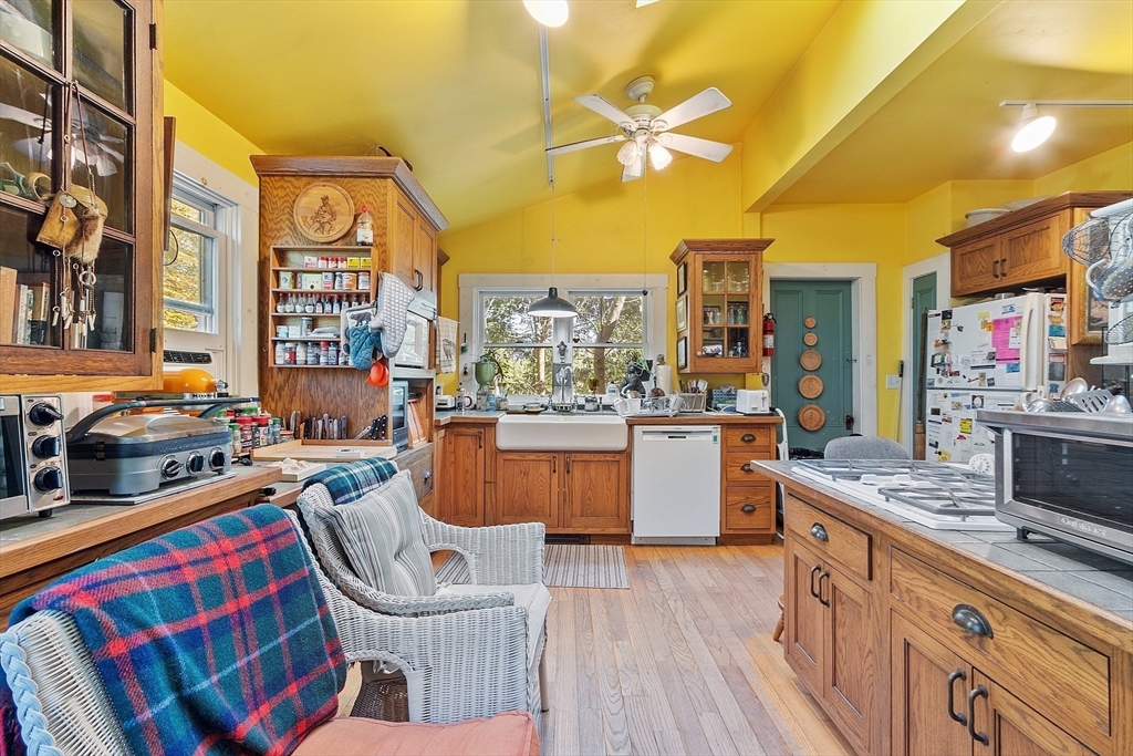 51 Farwell Road Tyngsborough, MA 01879 - Photo 4 of 33 a kitchen that has a lot of cabinets in it