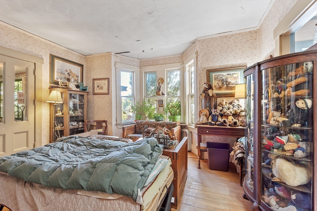 51 Farwell Road Tyngsborough, MA 01879 - Photo 9 of 33 a bed sitting in a bedroom next to a window