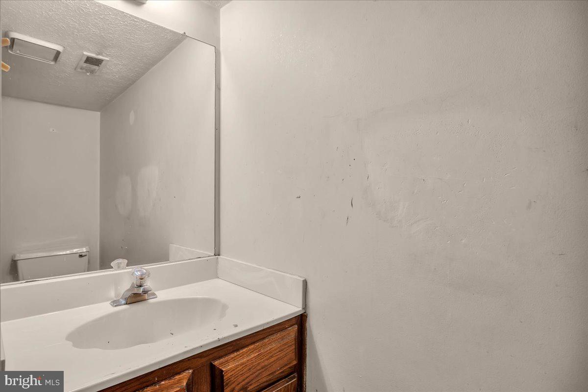 11 Decatur Lane Sicklerville, NJ 08081 - Photo 12 of 24 a bathroom with a sink and a mirror