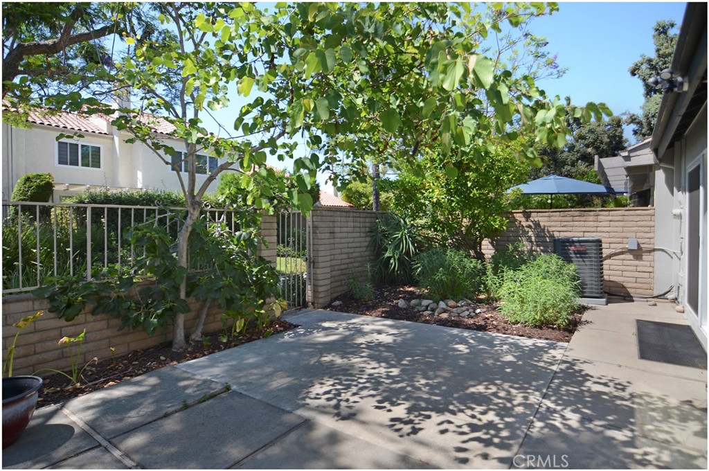 55 Oak Tree Lane Irvine, CA 92612 - Photo 17 of 27 a view of a house with a tree in front