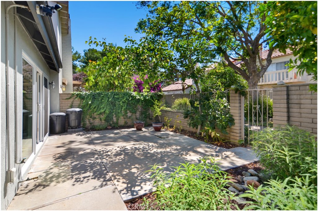 55 Oak Tree Lane Irvine, CA 92612 - Photo 18 of 27 a backyard of a house with lots of green space