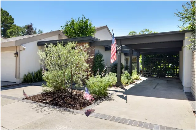 a view of a potted plants in front of a house
