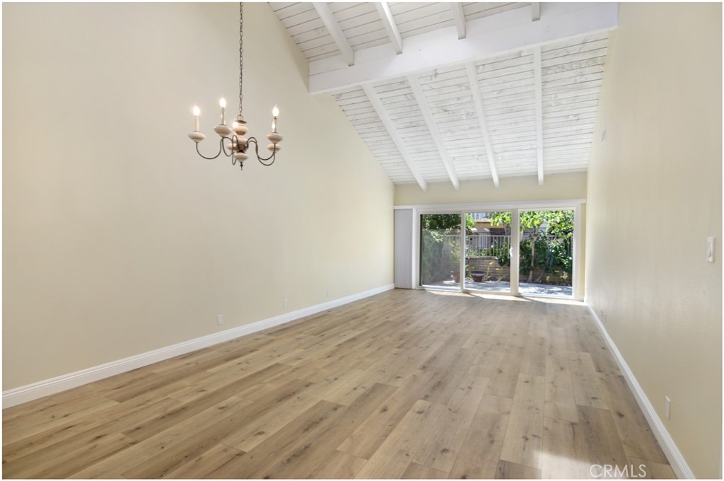 55 Oak Tree Lane Irvine, CA 92612 - Photo 2 of 27 a view of empty room with wooden floor and fan