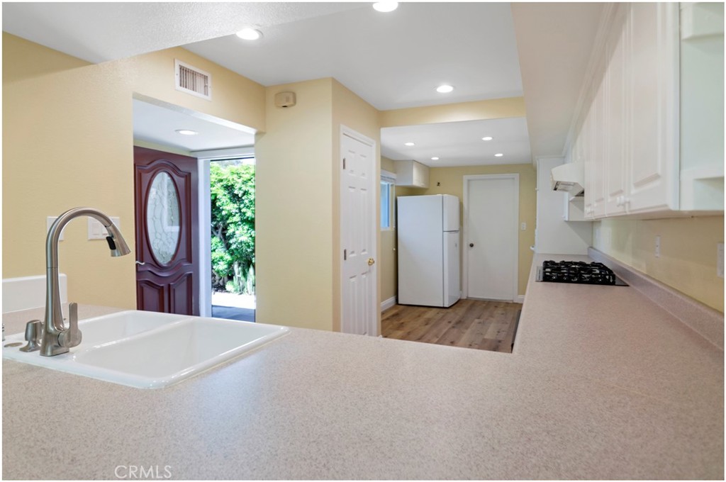 55 Oak Tree Lane Irvine, CA 92612 - Photo 6 of 27 a spacious bathroom with a granite countertop sink a toilet and a mirror