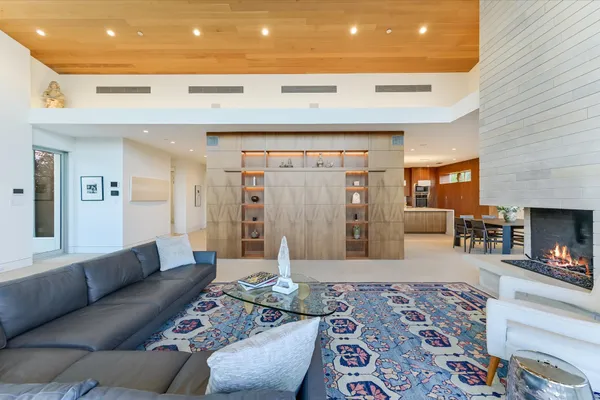 a large kitchen with a table and chairs