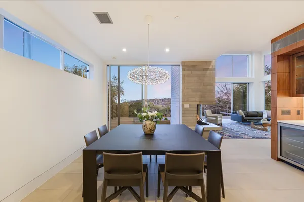 a spacious bedroom with a bed and lamp