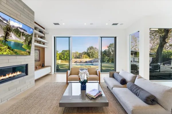 a room with furniture and large window