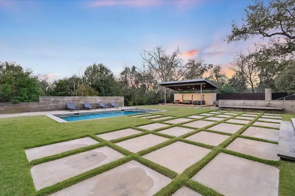 a view of a swimming pool with a patio