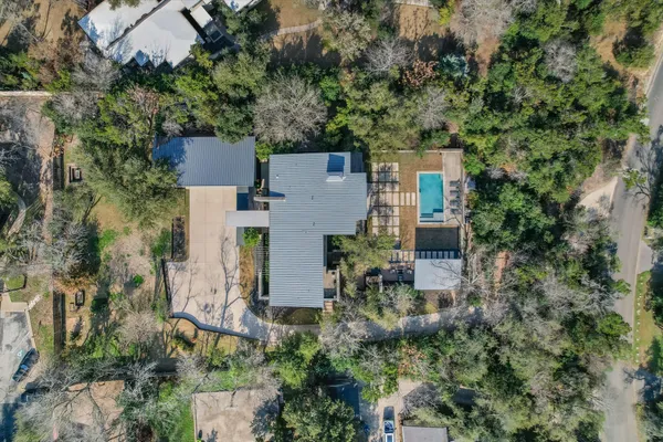 an aerial view of a house with a yard