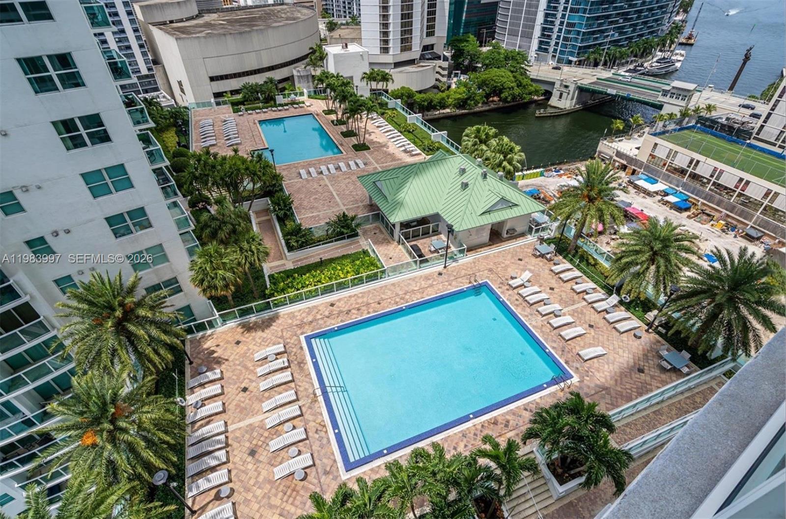 41 Southeast 5th Street, Unit 1106 Miami, FL 33131 - Photo 2 of 10 an aerial view of residential houses with outdoor space and swimming pool