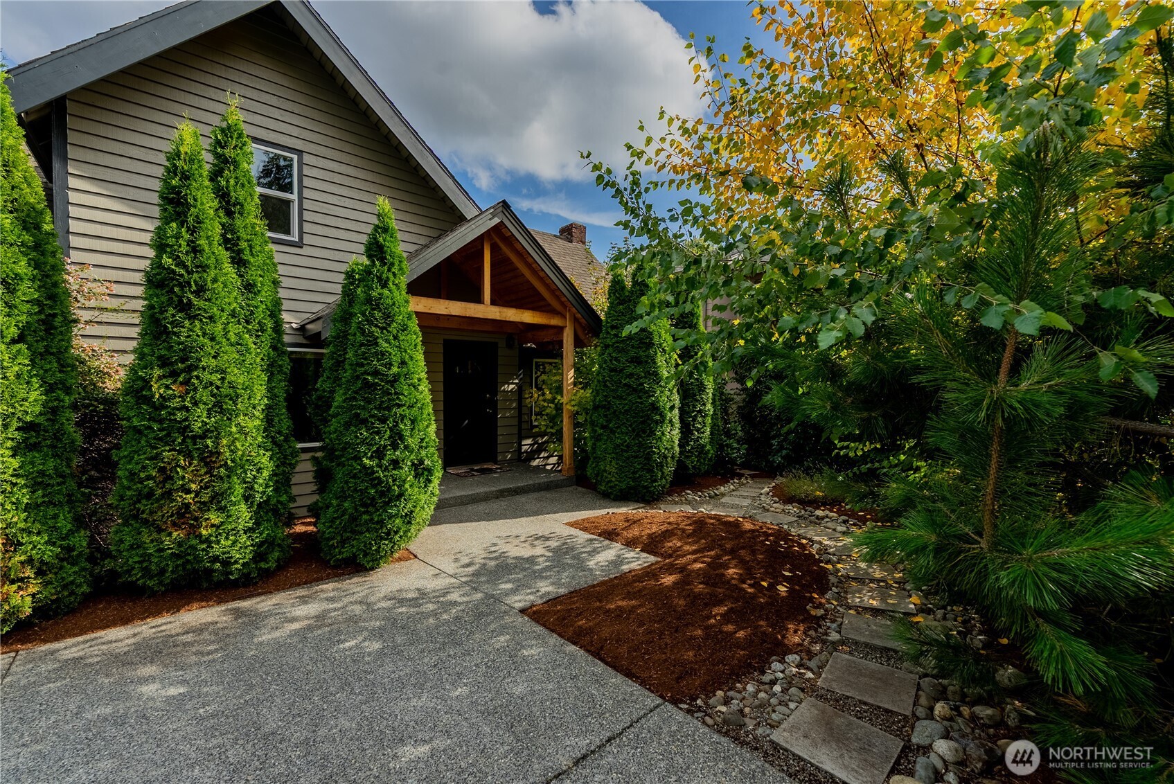 a front view of a house with garden