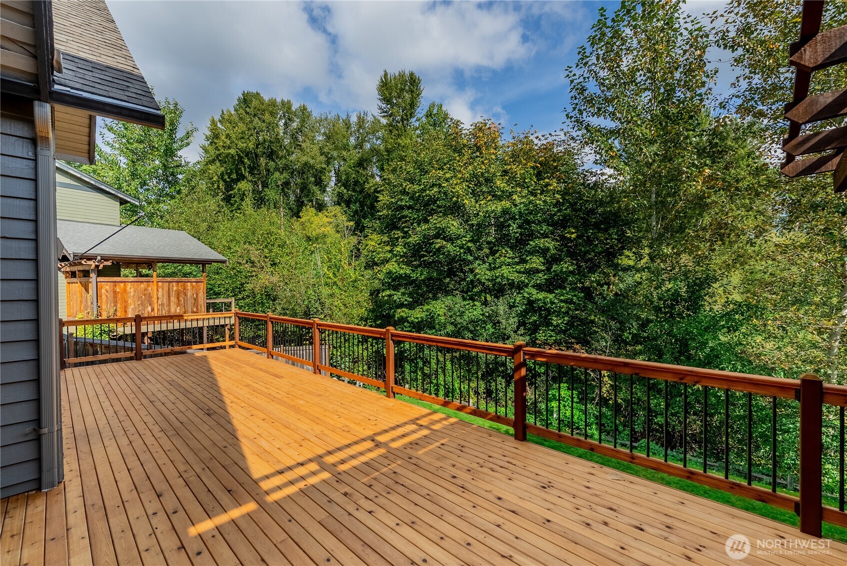 20006 68th Avenue Northeast Kenmore, WA 98028 - Photo 17 of 40 a view of a balcony with wooden floor and fence