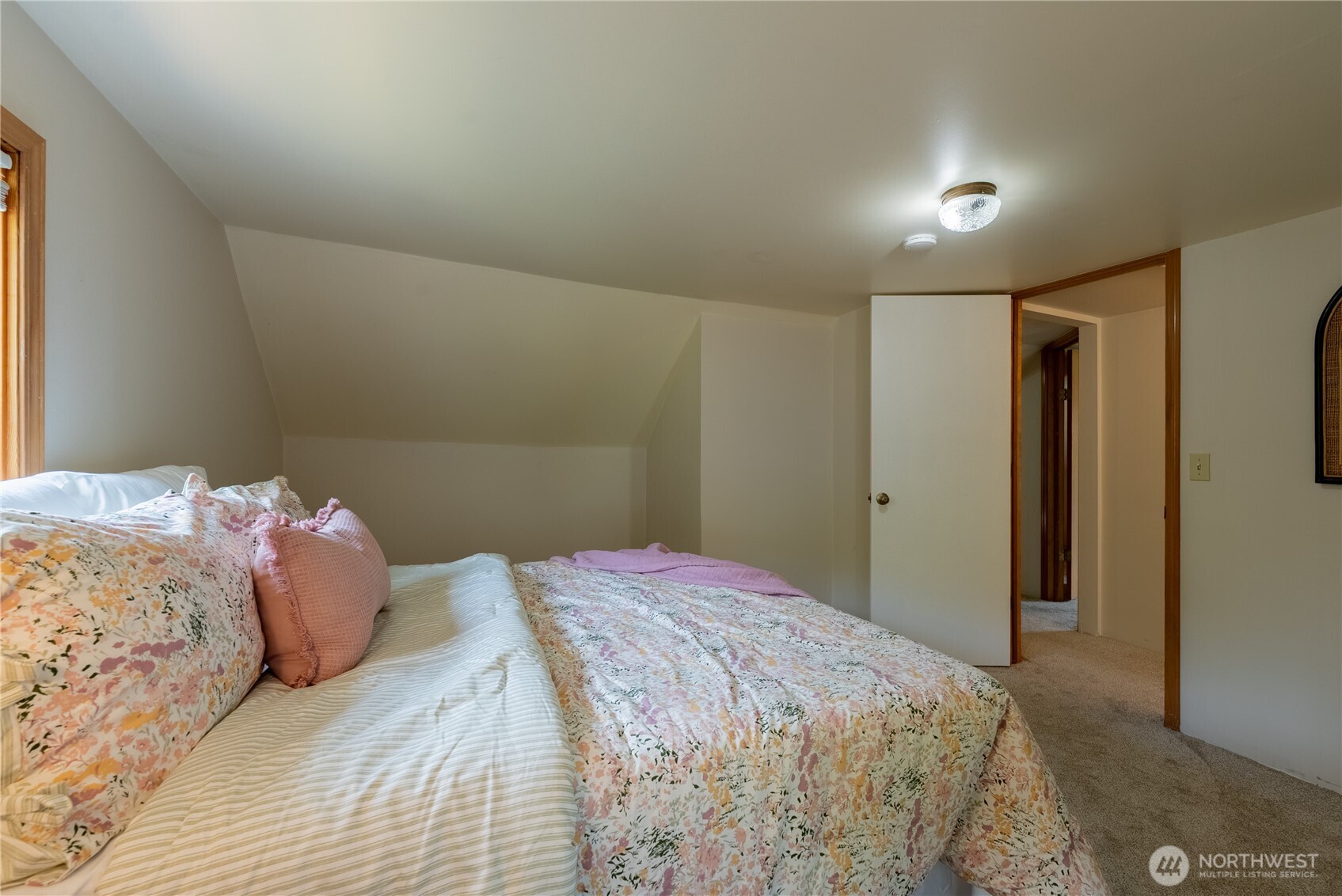 20006 68th Avenue Northeast Kenmore, WA 98028 - Photo 27 of 40 a bedroom with a bed and a mirror