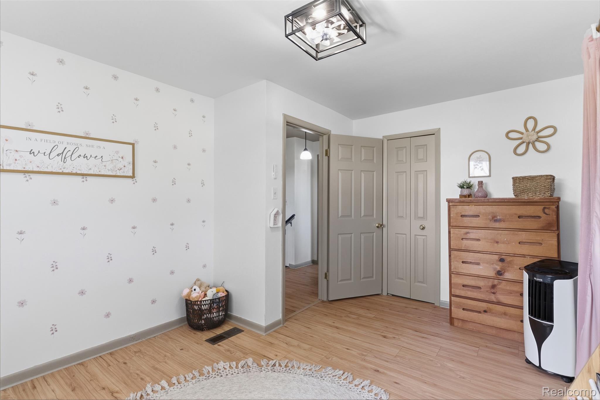 5843 West Dewey Road Owosso, MI 48867 - Photo 30 of 58 Light wood-finish flooring complements the neutral wall color