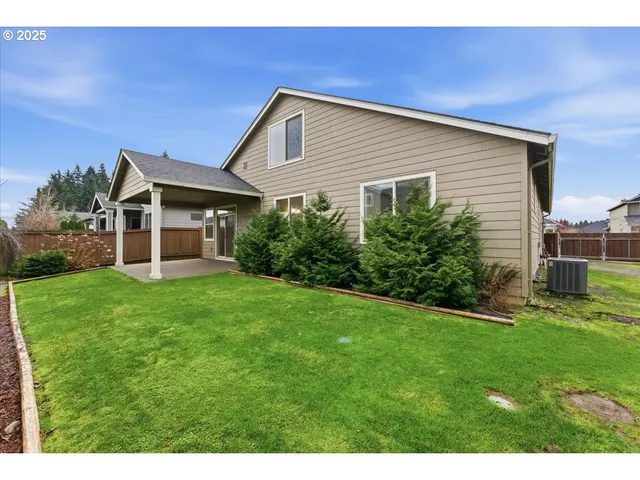 a front view of house with yard and outdoor seating