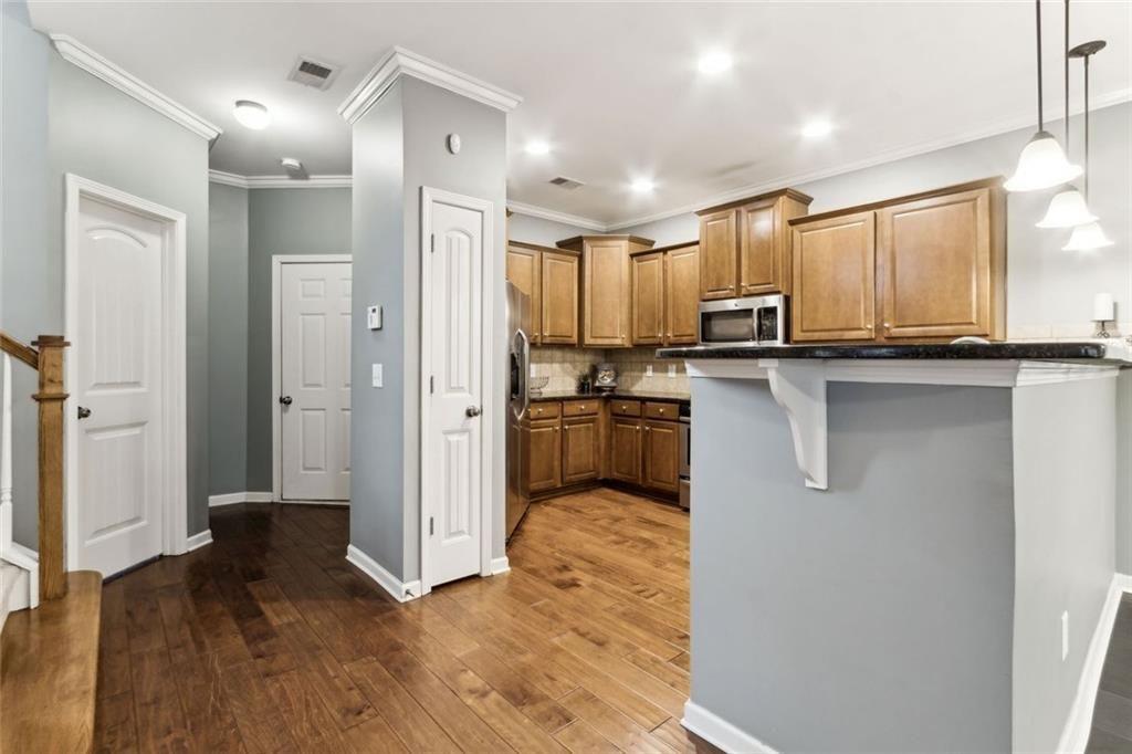 149 Trailside Circle Hiram, GA 30141 - Photo 12 of 35 a kitchen with stainless steel appliances a refrigerator and a stove top oven