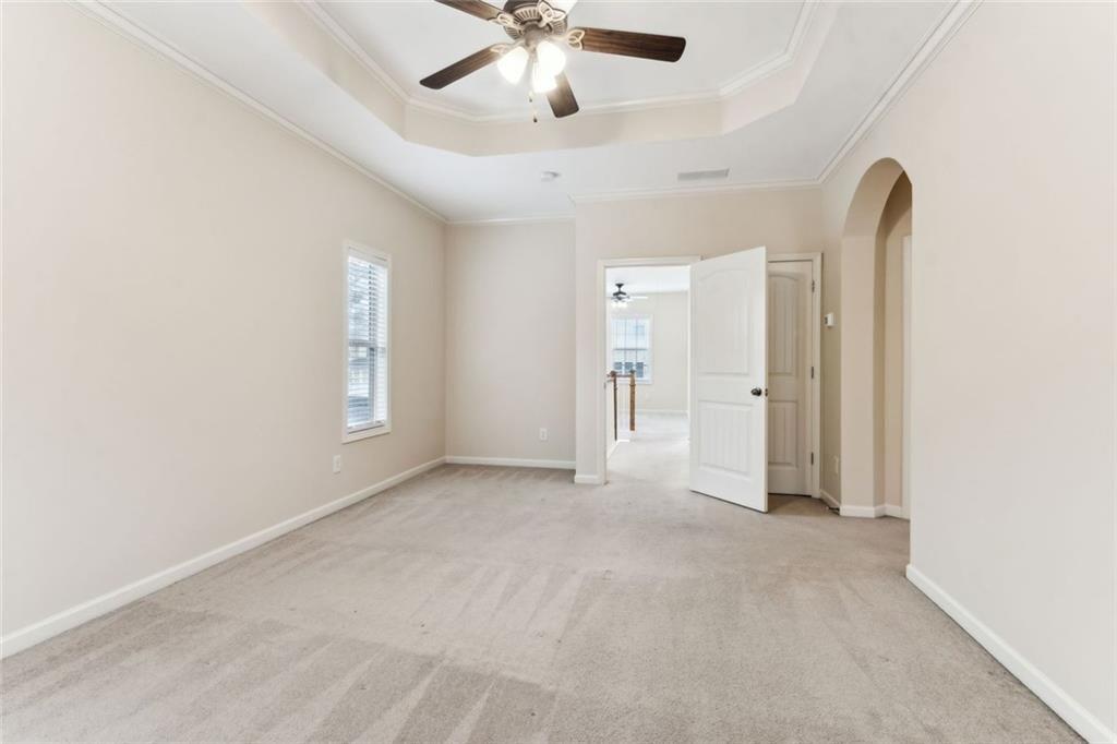 149 Trailside Circle Hiram, GA 30141 - Photo 18 of 35 an empty room with chandelier fan and windows