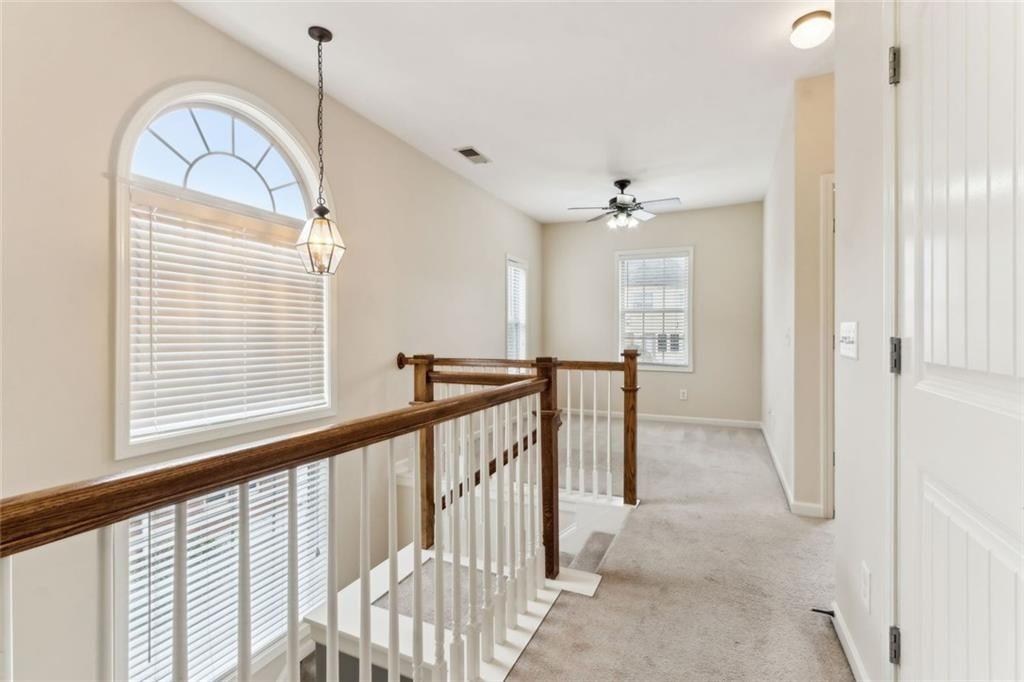 149 Trailside Circle Hiram, GA 30141 - Photo 22 of 35 a view of a hallway with windows and chandelier