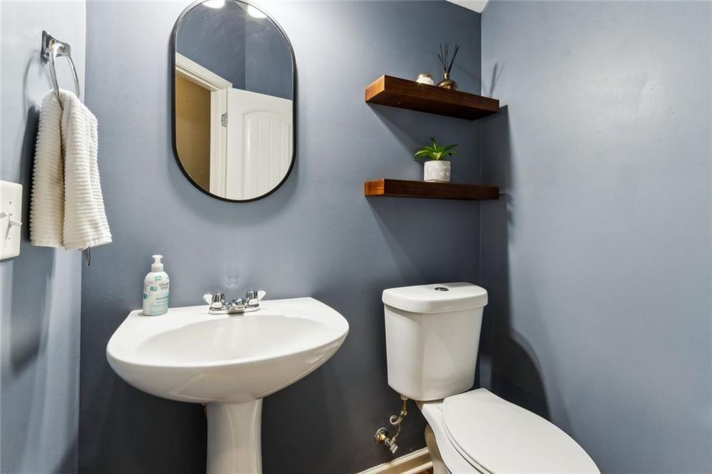 149 Trailside Circle Hiram, GA 30141 - Photo 26 of 35 a bathroom with a toilet sink and mirror