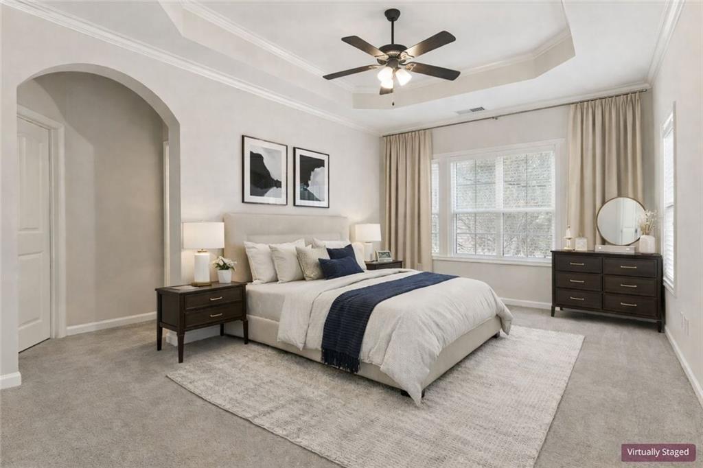 149 Trailside Circle Hiram, GA 30141 - Photo 5 of 35 a spacious bedroom with a bed a dresser and a window