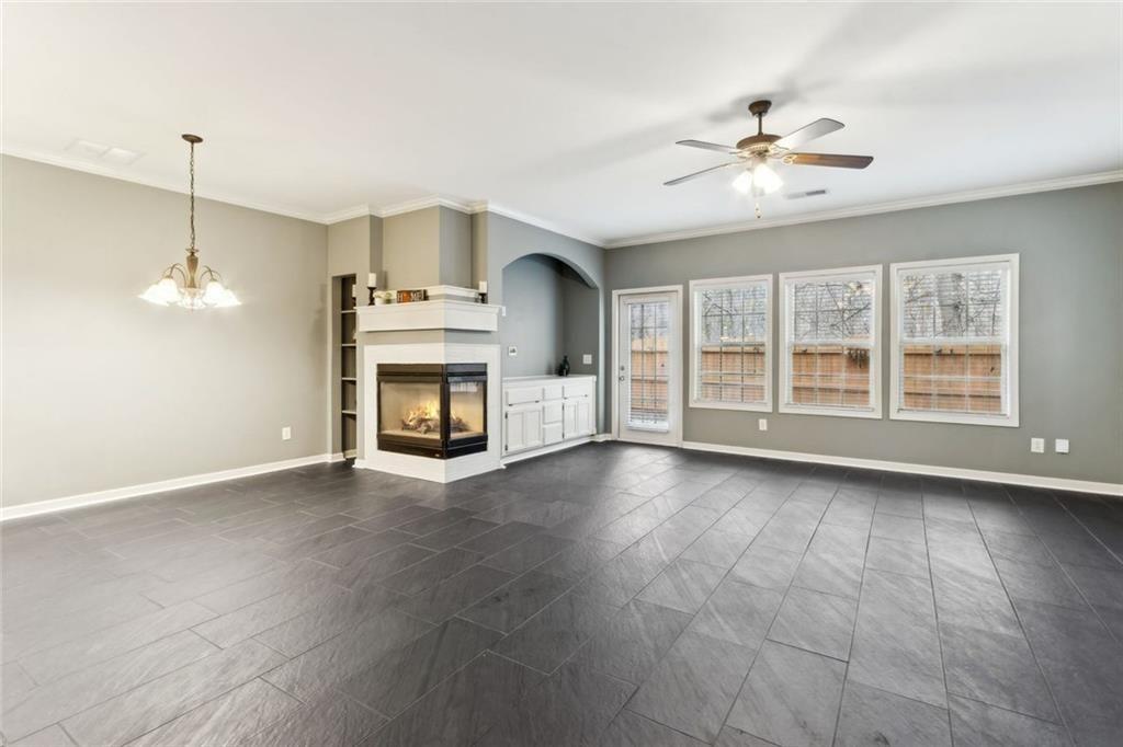 149 Trailside Circle Hiram, GA 30141 - Photo 9 of 35 a view of an empty room with wooden floor and fireplace