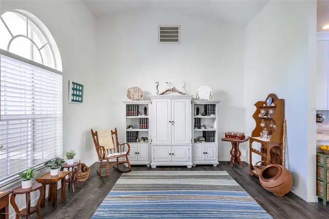 a large kitchen with a table and chairs