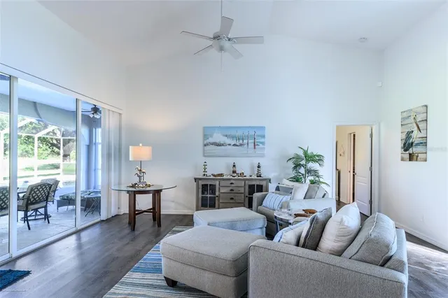 a kitchen with stainless steel appliances kitchen island granite countertop a refrigerator and a sink