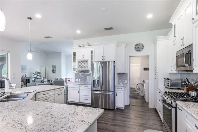 a bedroom with a bed and a lamp on table