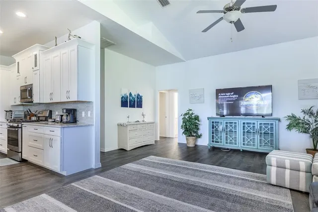 a bathroom with a double vanity sink mirror and shower