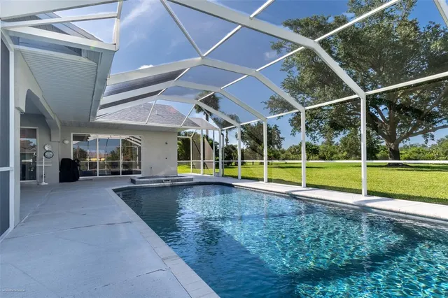 a living room with fireplace furniture and a wooden floor