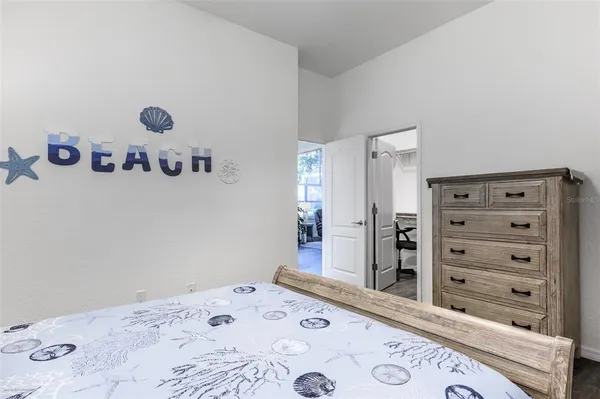a room with furniture and large windows