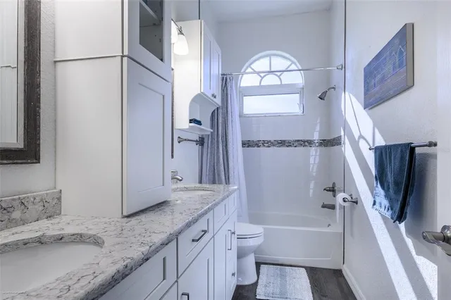 a view of a swimming pool with a patio and a yard