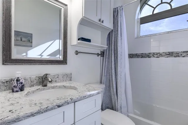 a view of a livingroom with furniture and window