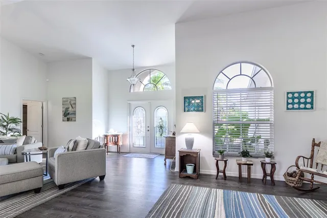 a view of a livingroom with furniture and hardwood floor